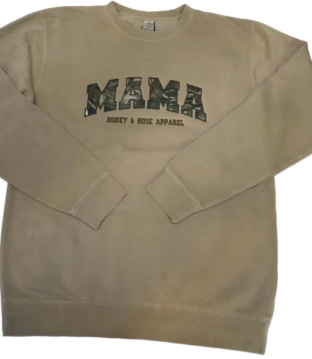 Beige sweatshirt with 'MAMA' text on a white background