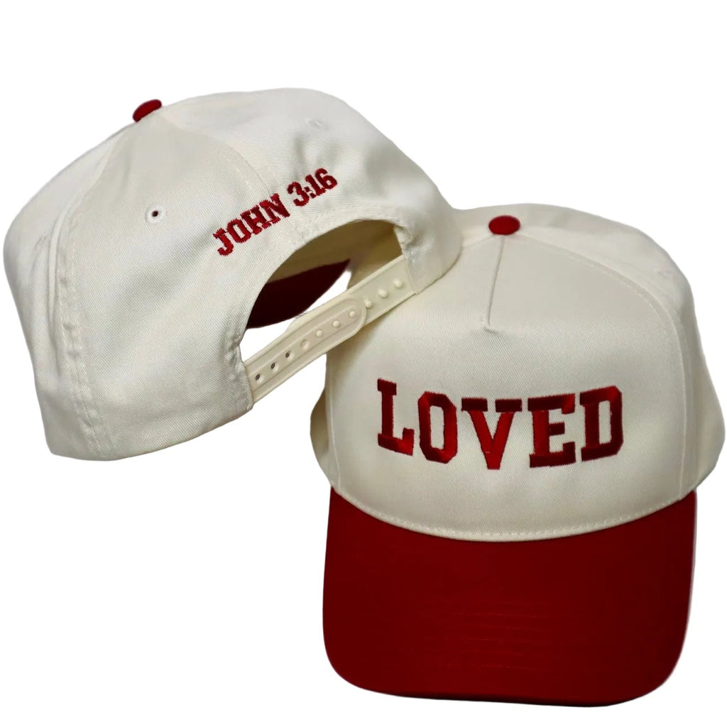 Two baseball caps with text on a white background