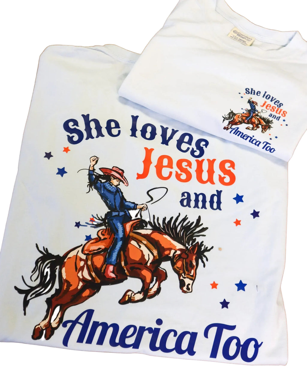 Two t-shirts with graphic designs and text on a wooden surface